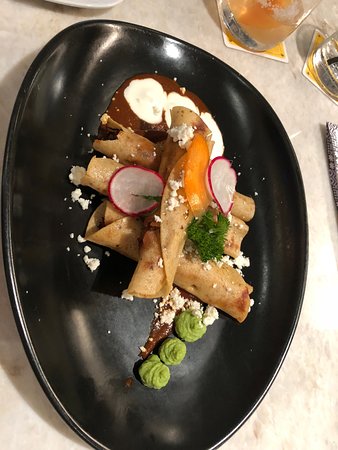 Xochi signature dishes Ceviche de AtunTaquitos DoradosTlayuda de Res